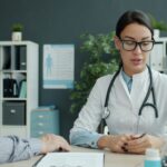 A caring doctor talking with an elderly patient during a diabetes consultation